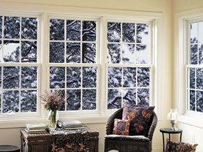 Double-hung energy-efficient windows show a snowy outdoor view